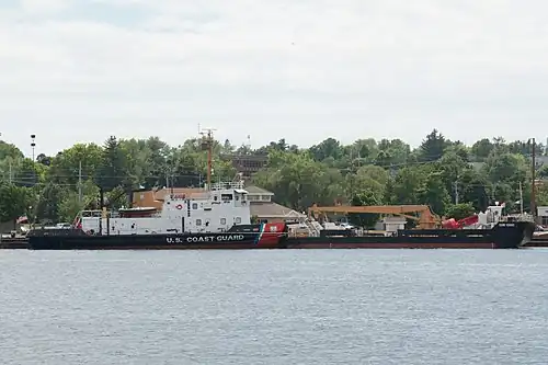 USCGC Mobile Bay, an icebreaking tug based out of Sturgeon Bay, with barge for servicing buoys