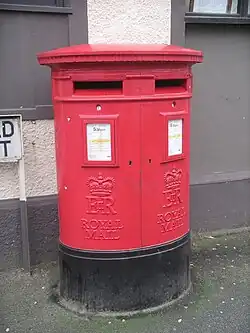 Modern Royal Mail branded EiiR Type C double aperture pillar box, Menai Bridge.