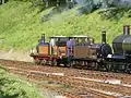 Stepney and Fenchurch on the Bluebell Railway (August 2007) showing the size difference compared to the larger GWR Dukedog engine just visible to the right, as well as the different styled smokebox on Fenchurch which is closer to the original styling.