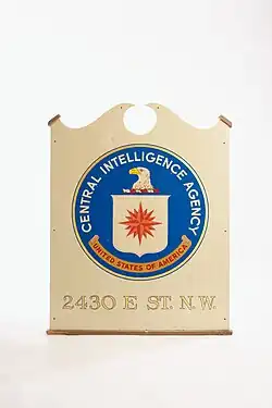 A picture of a sign with the CIA logo, and the words "2430 E. Street Northwest" below it.