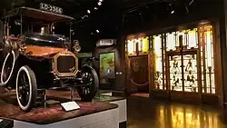 A UNIC taxicab and panels from a lift in Selfridges on display at the pre-2022 museum