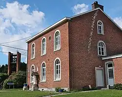 The modern campanile of Abolens, built in 1969