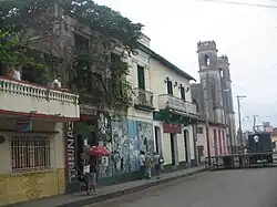View of El Mejunje with the Cathedral in background