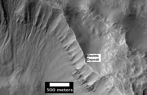 Layers in light-toned Electris deposit, as seen by HiRISE. Gullies are visible on the left.
