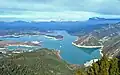 Embalse de Mediano, the tower of the Church of Mediano is visible