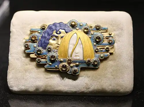 Appearances belt buckle, of gold, ivory, topaz, glazes, and cabachons, or rounded gemstones. designed by Eugène Grasset (c. 1900) (Musée d'Orsay)