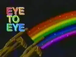 An image of two hands and a rainbow, over a black background. The show title is displayed on the left side of the image.