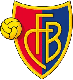 FC Barel crest of a shield, the left half red and the right half blue. The shield is outlined with gold and in the centre in gold letters it reads "FCB". On the left side of the logo is a gold football.
