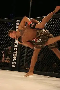 Image 34Fighter performs a takedown on his opponent. (from Mixed martial arts)
