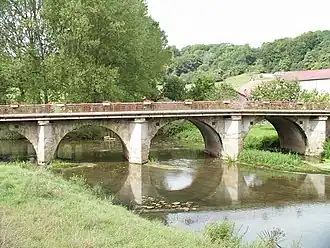 The bridge over the Mouzon in Pompierre