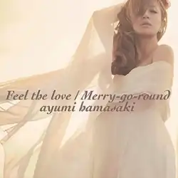 A portrait of singer Ayumi Hamasaki, wearing a beige coloured dress with the title and artist name superimposed on her.