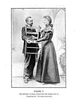 A person must stay on their feet while holding an the object after Hurst places her hands on it.