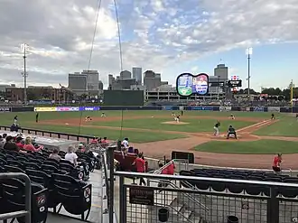 A daytime baseball game being played at First Tennessee Park