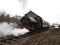 The Peckett and passenger coach passes the goods shed during the Whitwell station reopening