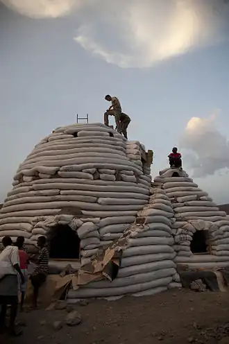Eco-Dome[47] sandbag shelter under construction in Djibouti