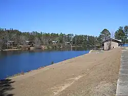Rental cabins in background, along reservoir cove