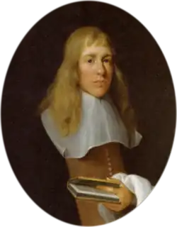 A man with long fair hair in 17th century dress