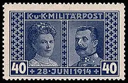 The bluish-tinted stamp shows Sophia, duchess of Hohenberg on the left, and Franz Ferdinand on the right. The stamp is titled "Militärpost" ("Military Mail") at the top, and the date of the couple's deaths at the bottom.
