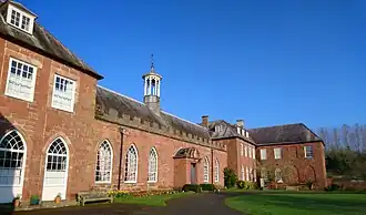 Angled photograph showing the front exterior of the Castle in the sunshine.