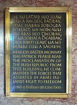 Plaque commemorating the Easter Rising at the General Post Office, Dublin, with the Irish text in Gaelic script, and the English text in regular Latin script