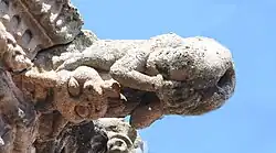 Gargoyle appearing to defecate