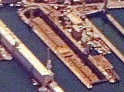 The wreck near the end of its final stage of demolition, with keel visible, in drydock No. 4 Genoa, 10 June 2017