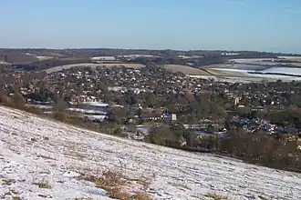 The river and gap seen from Lardon Chase on a snowy January day, with the Chilterns in the background