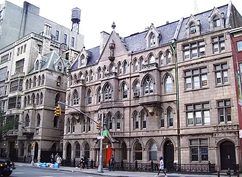 The church houses on Fourth Avenue, behind the church: Renwick's Memorial House takes up the three bays in the center, with Clergy House by Heins & LaFarge to its left, and Neighborhood House to its right.