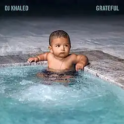 DJ Khaled’s baby son sitting in a swimming pool.