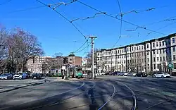 Commonwealth Avenue in Brighton, with a Green Line B branch train