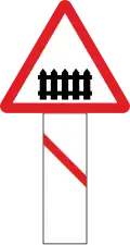 Guarded railway crossing (50-100 metres ahead)