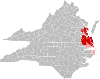 Jurisdictions in the Hampton Roads MSA are colored in red. Jurisdictions in the CSA, but not the MSA, are colored in pink.