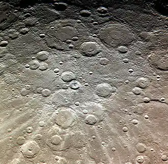 Exaggerated color image by MESSENGER with Van Gogh above center