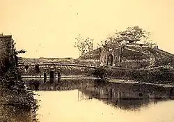 Front view of the North Gate with moat (1885)