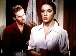 Black and white film still showing Katy Jurado with Charlton Heston
