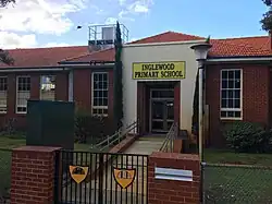 Brick school building with glass entrance doors