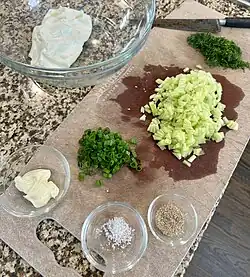 Ingredients for Benedictine spread: cream cheese, green onions, mayonnaise, salt, pepper, chopped cucumbers, dill