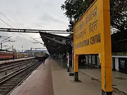 Looking down a platform as a train pulls in