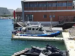 Israeli maritime police Defender-class boat Hazon and water scooter in Eilat Marina, Israel