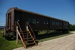 JNR 60 series passenger car on display in front of the station
