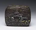 Iron, gold, and silver box showing a monkey and octopus tug-of-war
