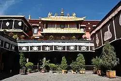 Temple courtyard with potted shrubs