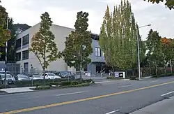 A three-story building with KCPQ and KZJO logos on a sign outside