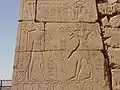A wall relief of Horemheb making an offering to Amun on the 10th pylon at Karnak