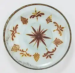 8th-9th-century dish with lustre paint, 25.1 cm (9.8 in) wide