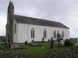 A picture of the Killyneill Catholic Church in Tyholland and its graveyard.