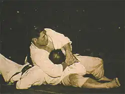 Image 9Masahiko Kimura vs. Hélio Gracie, a 1951 bout between Japanese judo fighter Masahiko Kimura and Brazilian jiu jitsu founder Hélio Gracie in Brazil, was an early high-profile mixed martial arts bout. (from Mixed martial arts)