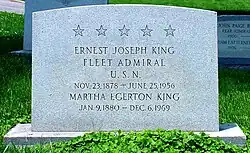 Color photograph of a gravestone in a cemetery. The gravestone reads: Five stars. "ERNEST JOSEPH KING; U. S. N.; NOV. 23, 1878 – JUNE 25, 1956; MARTHA EGERTON KING; JAN. 9, 1880 – DEC. 6, 1969