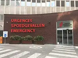 Trilingual signage in French, Dutch and English at an emergency department in Brussels, Belgium