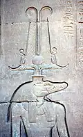 A wall relief from Kom Ombo showing Sobek with solar attributes
